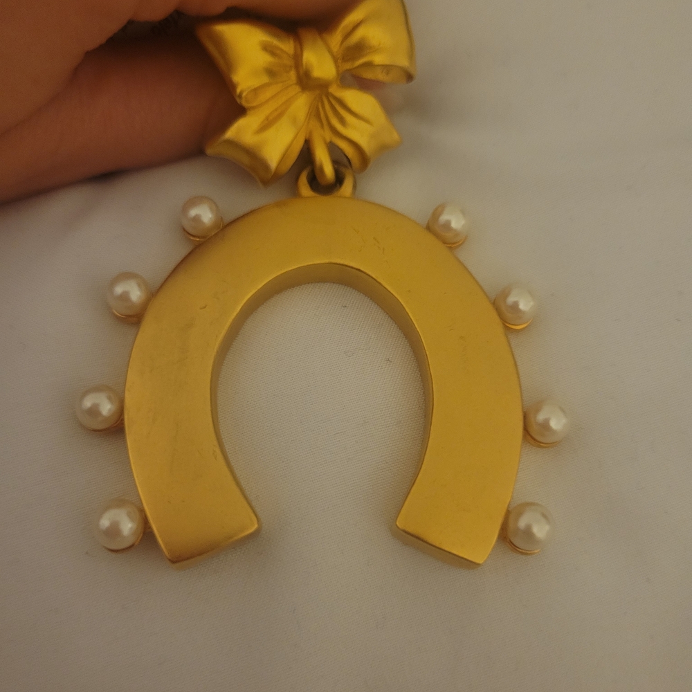 Vintage Karl Lagerfeld Gold Tone Horseshoe Brooch With Gold Bow And Faux Pearls